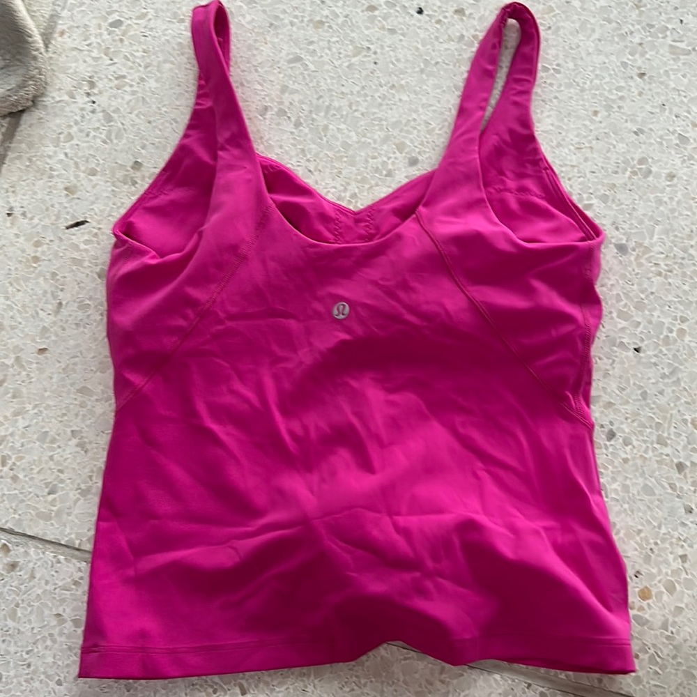 Waist length, built-in bra. Never used.